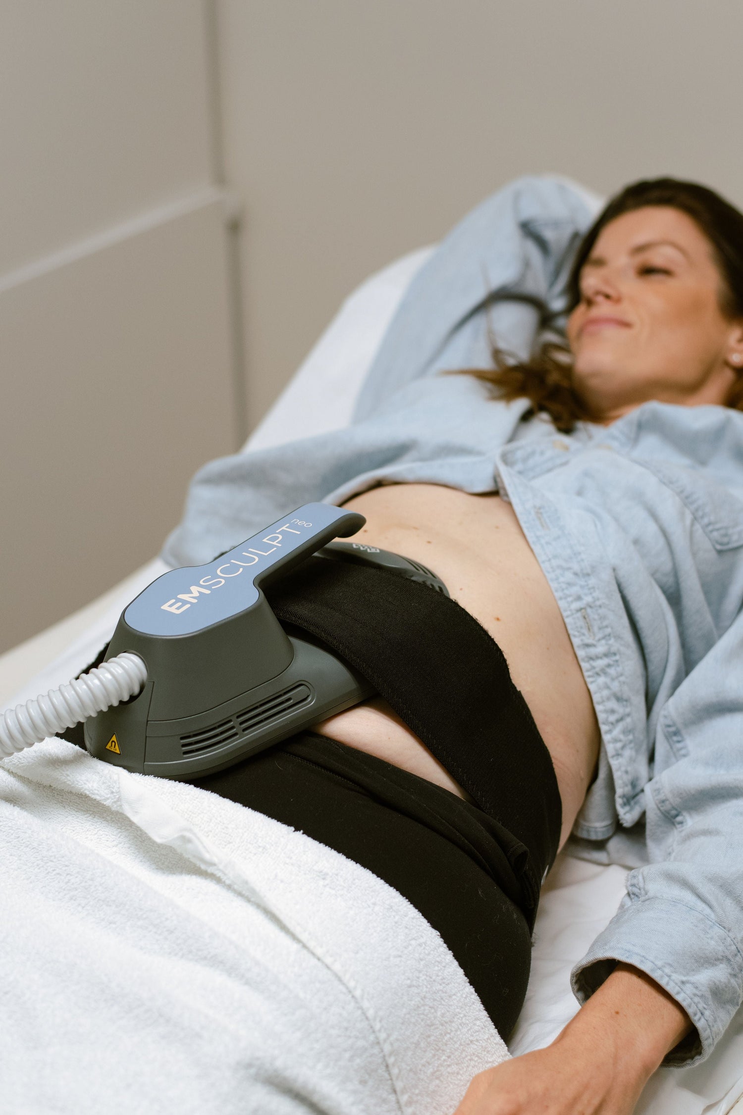 Emsculpt NEO session targeting abdominal muscles for strength and body support