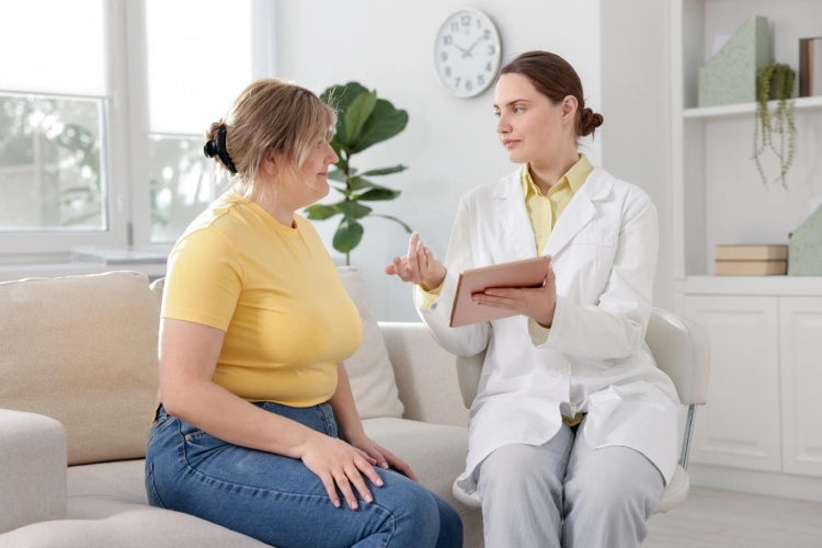 Patient discussing pelvic floor concerns with a practitioner during a consultation.